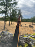 Pacific Yew takedown longbow, with rawhide back and Elk antler tips.